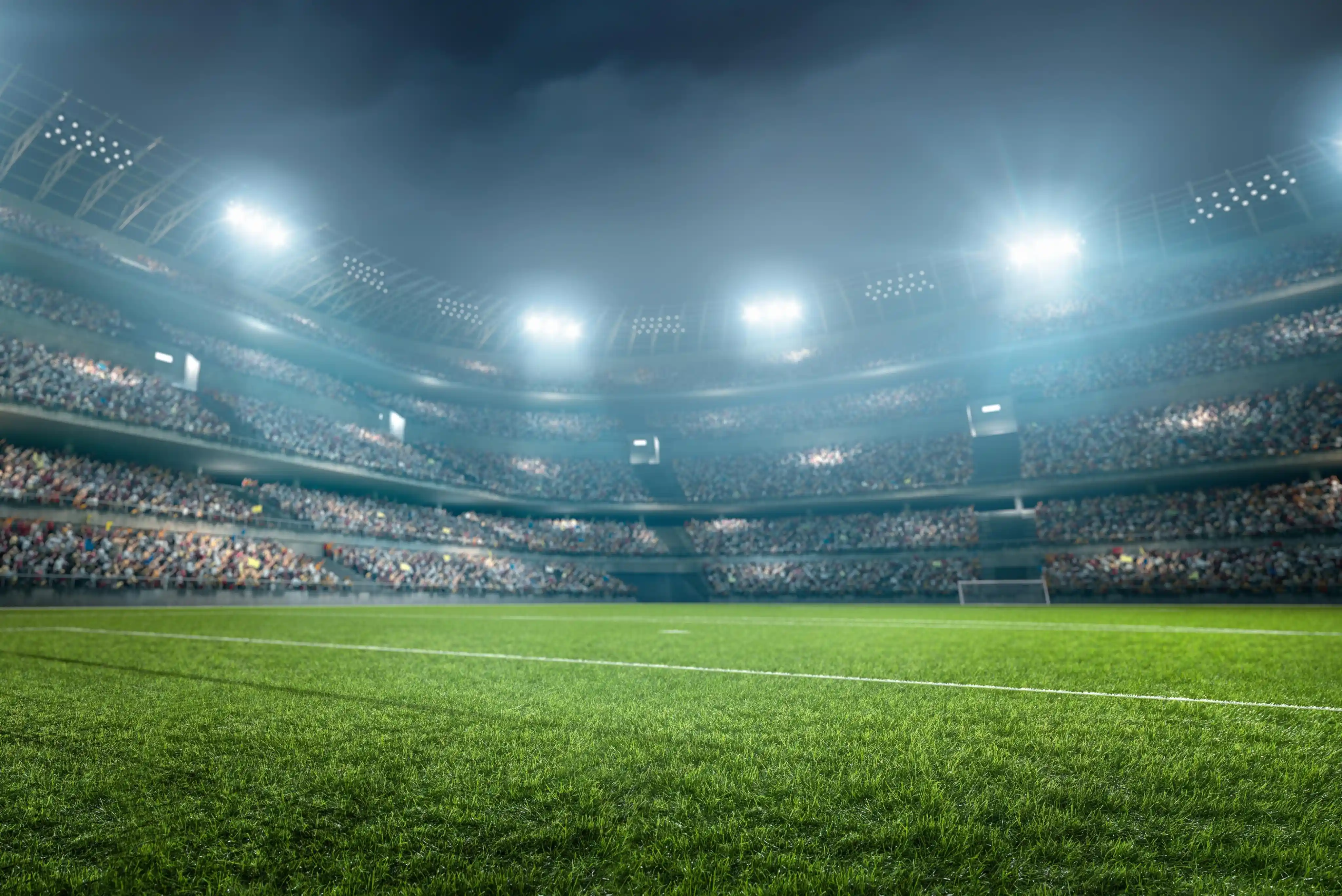 Estadio deportivo iluminado de noche